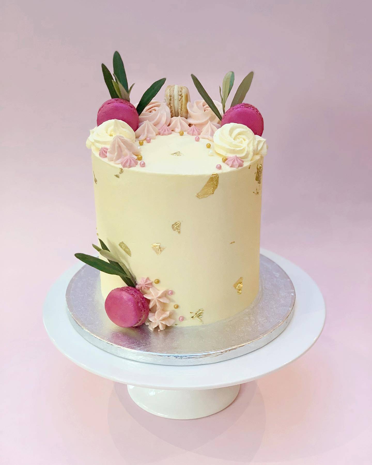 Pink macarons and gold leaf cake